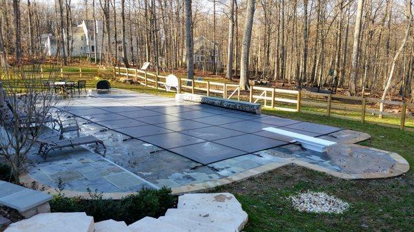 Custom mesh safety covers provide a layer of protection to your pool area in the 'off-season'.