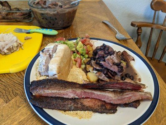 The Brazilian inspired dinner I made with the groceries: pork, bacon, beans, yucca, and pico.