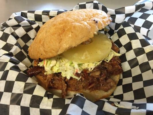 My Husband got The Hawaiian. Tender pulled pork with Hawaiian flavor topped with a pineapple ring, angel hair slaw on a toasted roll.