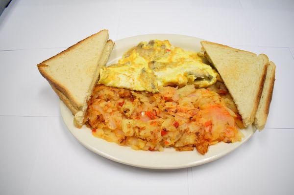 Desayuno americano papas de la casa y huevos con champiñones y pan tostado