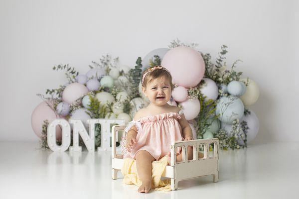 Floral cake smash session of baby in Brooklyn Baby photo studio