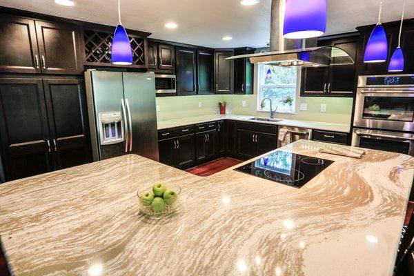 Beautiful cabinets and luxury quartz countertops complete this major kitchen renovation.