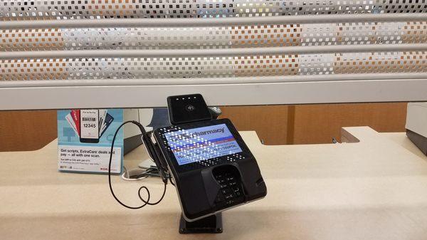 this is the pharmacy counter with the gate almost all the way down. they slide your meds under this gate. horrible.