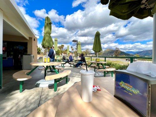 Outdoor seating with umbrellas for shade.