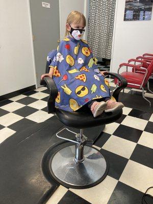 My preschool kid watching Paw Patrol during her haircut