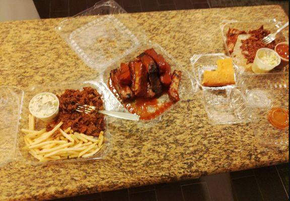 Horrible and disgusting. This is what we threw away!!! Fries undercooked, beans undercooked, nasty, over-sauced brisket, tough ribs.