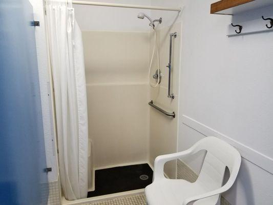 Handicapped shower stall available for use.