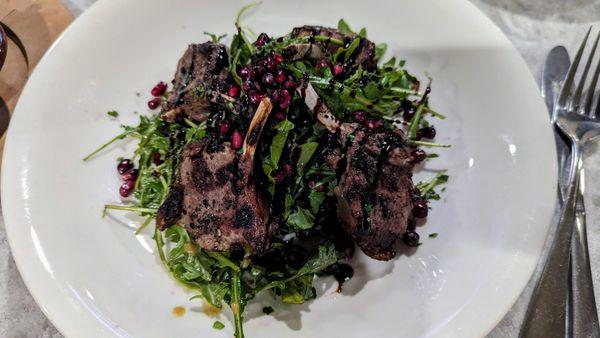 Lamb Lollipops w/ arugula and pomegranate seeds