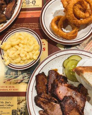 Brisket plate with mac and cheese and onion rings.