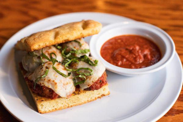 Our Meatball Focaccia Sandwich comes with a side of marinara sauce for dipping.