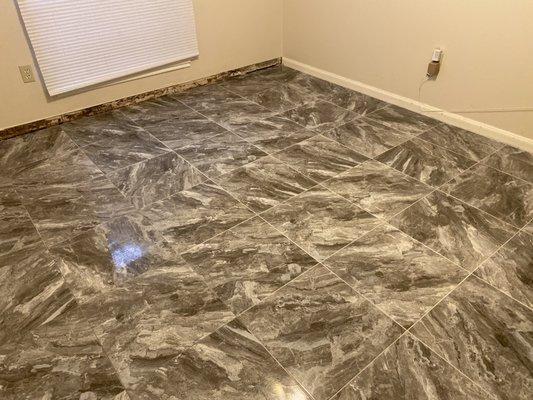 Tile installation in bedroom.
18x18 with a 3/16 grout joint.