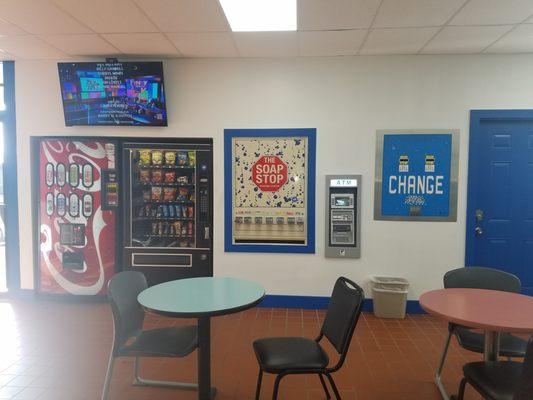 Snack/Pop machine, laundry soap vendor, change machine, and a new ATM machine.