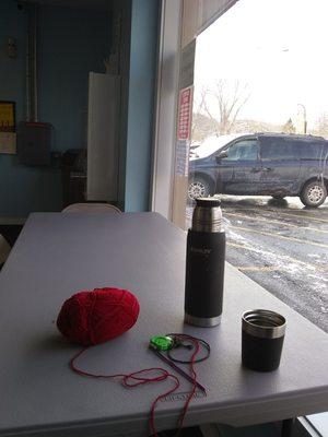 Chilling at the laundromat. Doing laundry, crocheting and sipping coffee.