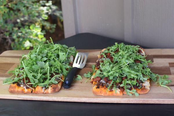 Flat bread with chorizo, arugula, balsamic glaze and other yummy stuff. You get to pick your favorite toppings from a long list