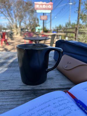 Outside getting some writing down while having a hot mocha