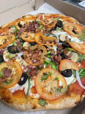 Mostly veggie but topped with bacon on our gluten free 12" crust you would never guess is gluten free!!