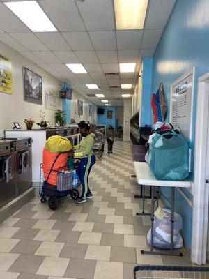 Retro Laundromat Laundry service Wash and Fold customers Drop off center same day service pickup.