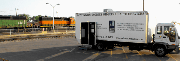 Our 8 man mobile health testing truck parked outside to help with hearing testing.