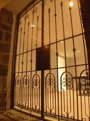 Private residence wine room doors to match the exterior handrail.   The 288 bottle wine room is also refridgerated.