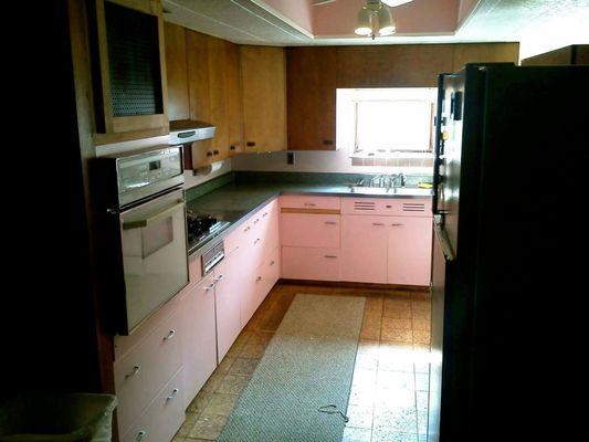 1950's metal kitchen cabinets.  Weekly guests may share the kitchen