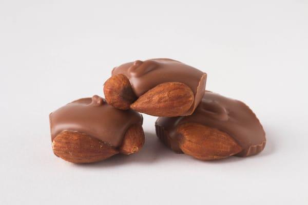 Milk Chocolate Almond Squares - two crisp almonds embedded in delicious Belgian milk chocolate.