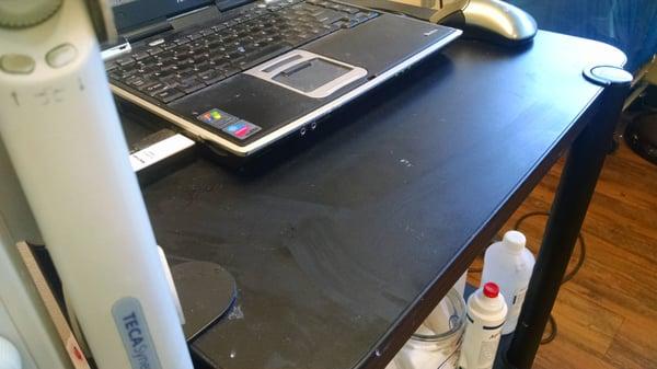 Dirt and dried blood on computer table