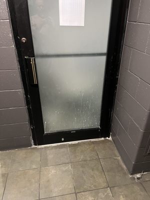 Maintenance room door in men's locker room