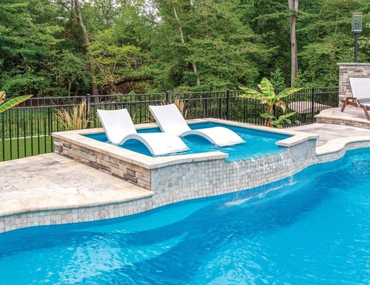 Add a tanning deck to your new pool to catch some rays before jumping in.