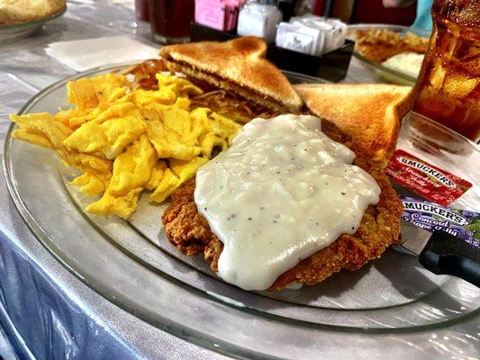 Chicken Fried Steak with White Gravy, Scrambled Eggs, Hashbrowns and Toast. Crunchy and fresh made. Very good! Give it a try!