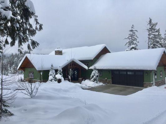 Front walkway and driveway pad have hydronic heating underneath.