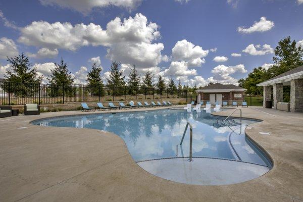 Salt water pool with relaxing in-pool loungers.