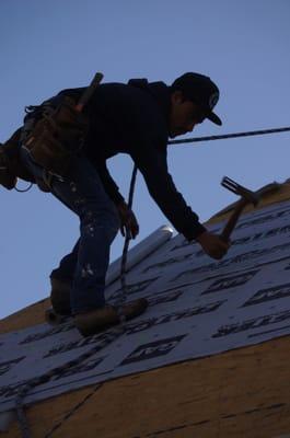 Installing Feltbuster underlayment.