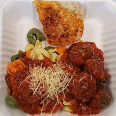 Tortellini with meatballs and marinara.