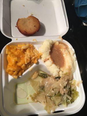 Three veggie plate...cabbage, mashed potatoes w/gravy, Mac & cheese and cornbread muffin