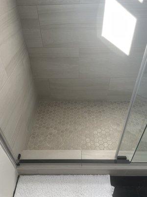 New walk in shower with beautiful 1x1 in mosaic tile on shower floor, new classic , timeless ceramic tile in walls & new shower fixtures.