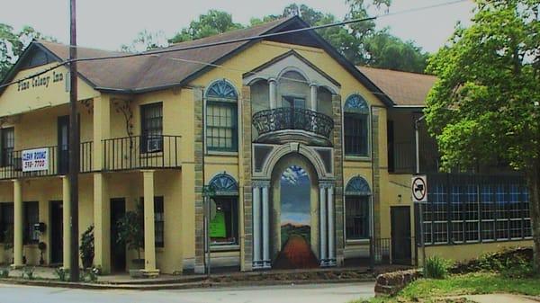 View of the mural from the street.  Inside the 2 lower windows is the Custom Frame Shop.