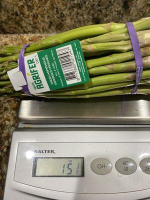 Almost 1 lb asparagus.  Each bundle rang up as 2  lbs.