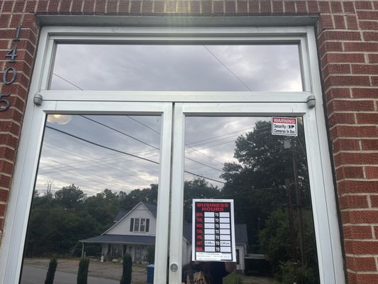 Front Door with Business Hours Posted