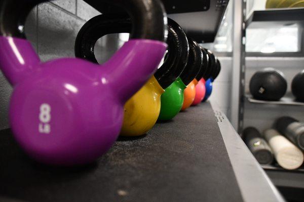 Free weights at Dimensions Fitness Center