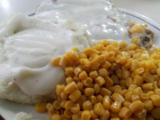 Chicken fried steak with mashed potatoes and corn