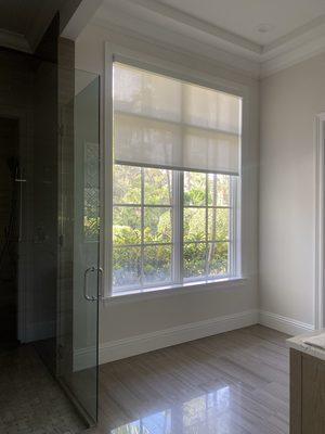 Beautiful roller shade with custom cornice for this stunning home!