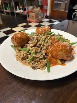 Bison meatball over farro