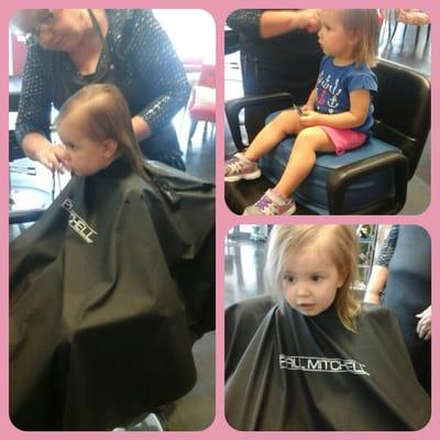 Stylist Lola giving a children's haircut