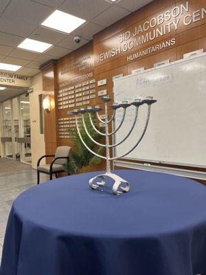 Chanukah menorah in entrance lobby waiting for candle lighting at sundown