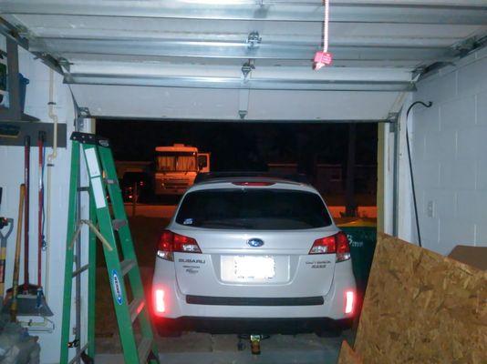 I had to back my car in the garage opening in hopes that no one would come in the house. See the upper left, the roller is off the track!