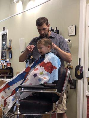 He was ready for his hair cut and most of all lollipop