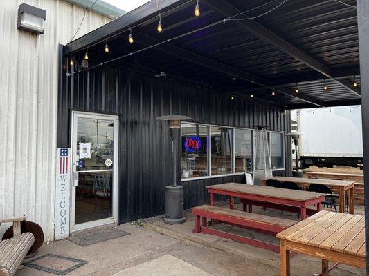 Outdoor seating area; inside has a cozy farmhouse feel