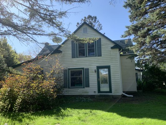 After photo - 4 trees were removed on the NW side of the home. This opened up the area, made it lighter inside, and made it more welcoming!