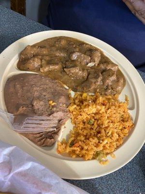 This is the carne guisada plate. Tender, and the gravy is spicy, rich, and like mom makes.