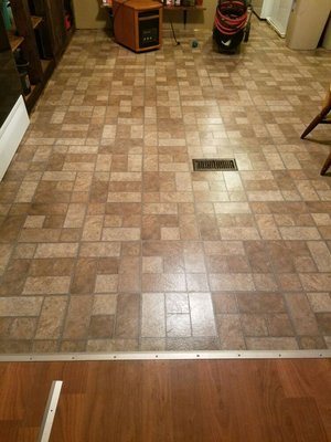 Vinyl tile flooring install.